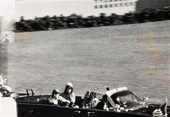 (KENNEDY, PRESIDENT JOHN F.--ASSASINATION) Group of 4 sequential photographs of frames from the Abraham Zapruder film.